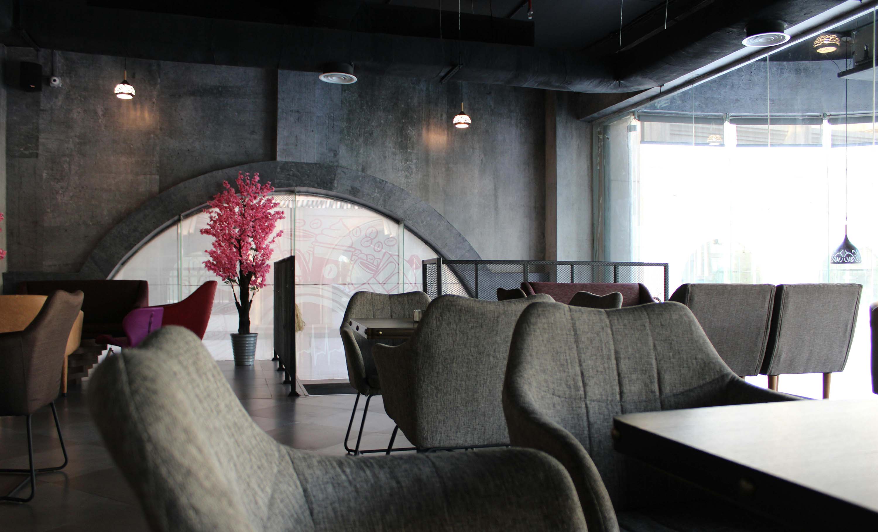 grey room with pink tree and exposed hvac